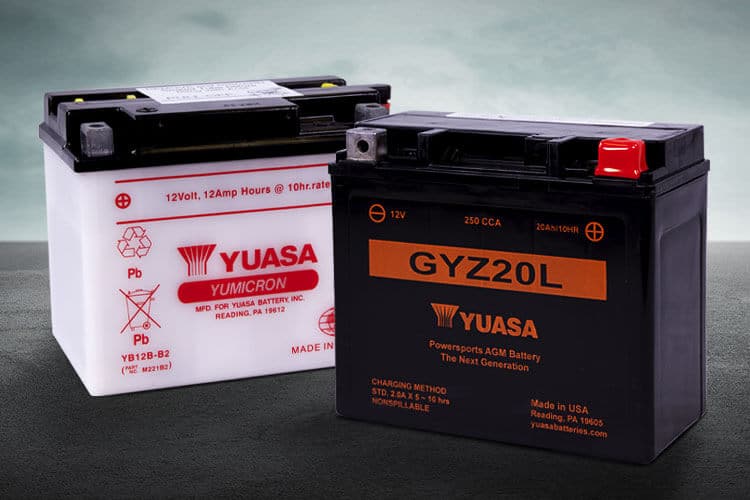 yuasa AGM battery in black with GYZ20L written in orange and conventional battery with white case and red letters reading Yuasa
