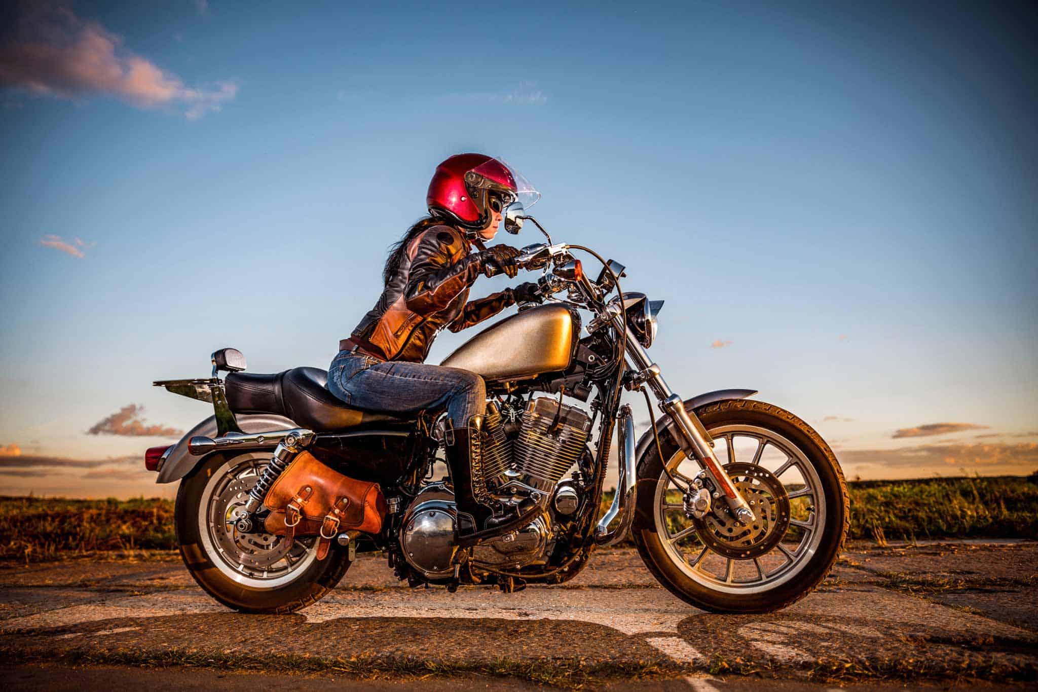 Woman riding a Harley powered by Yuasa Battery