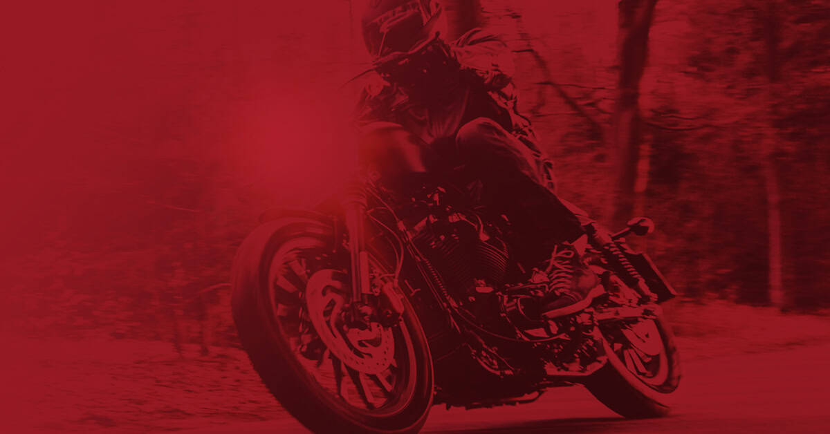 Rider turns his bike towards the road, using a Yuasa Battery for his Indian Bike.
