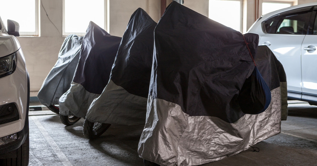 Stored motorcycles under covers. 