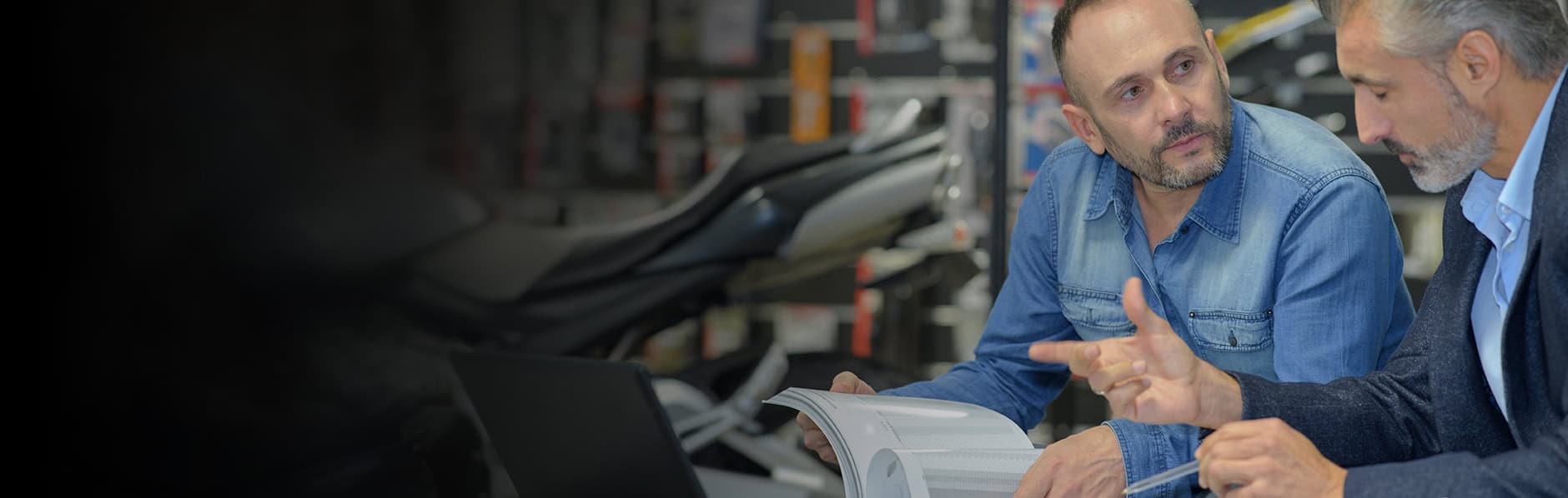 Customer talks to authorized Yuasa Battery dealer about their battery purchase.