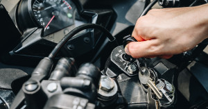 Person holding the key in the starter.