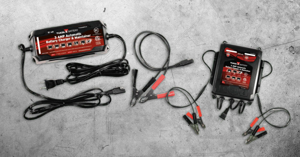 Yuasa charger battery maintainers with cables.