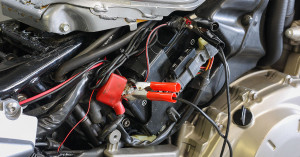 Motorcycle battery with a maintainer attached.
