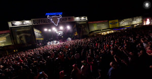 Buffalo Chip stage with a concert in progress, shows the crowd and signage around the stage.